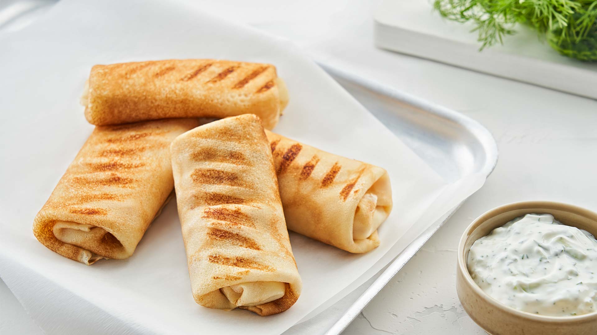Grilled pancakes with ham and cheese