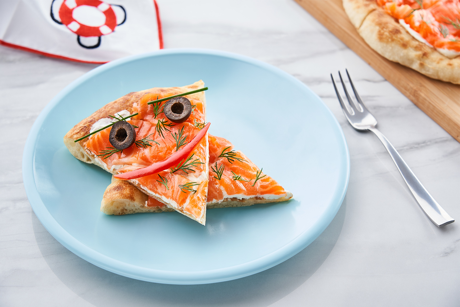 Pizza with cream cheese, salmon and dill