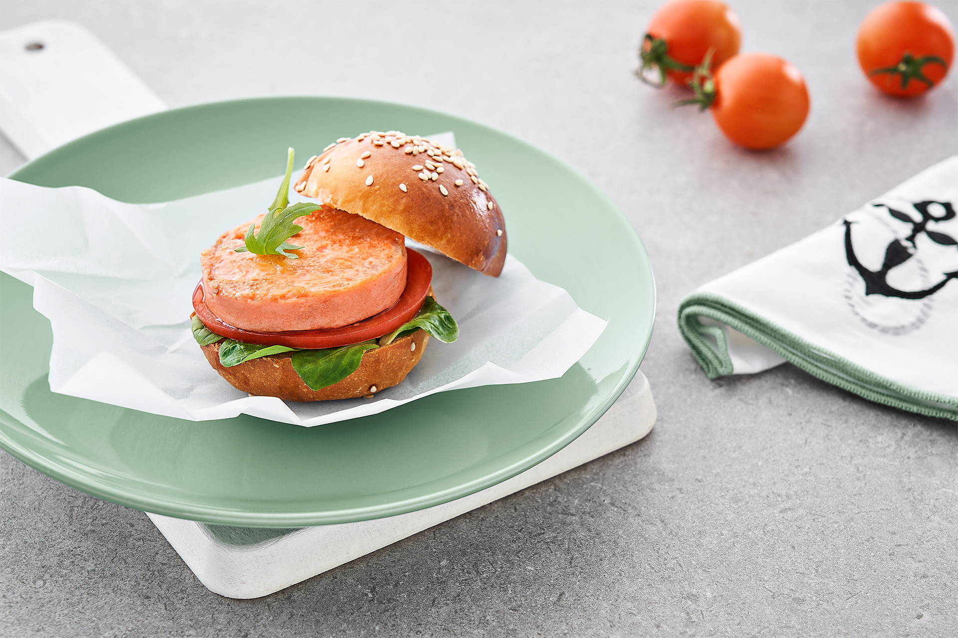 Juicy burger with salmon and tartar sauce