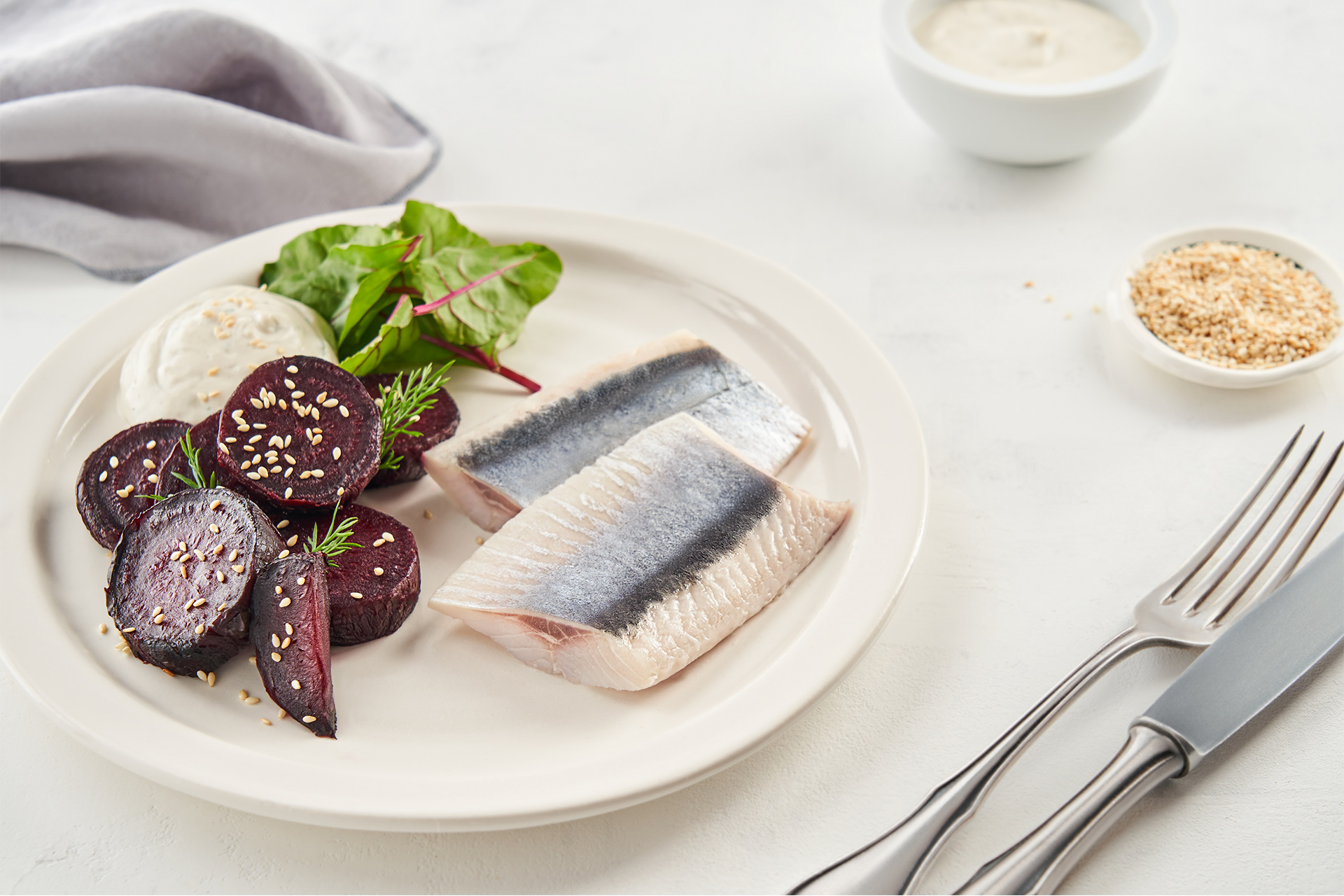 Baked beet with herring and yogurt-sesame sauce